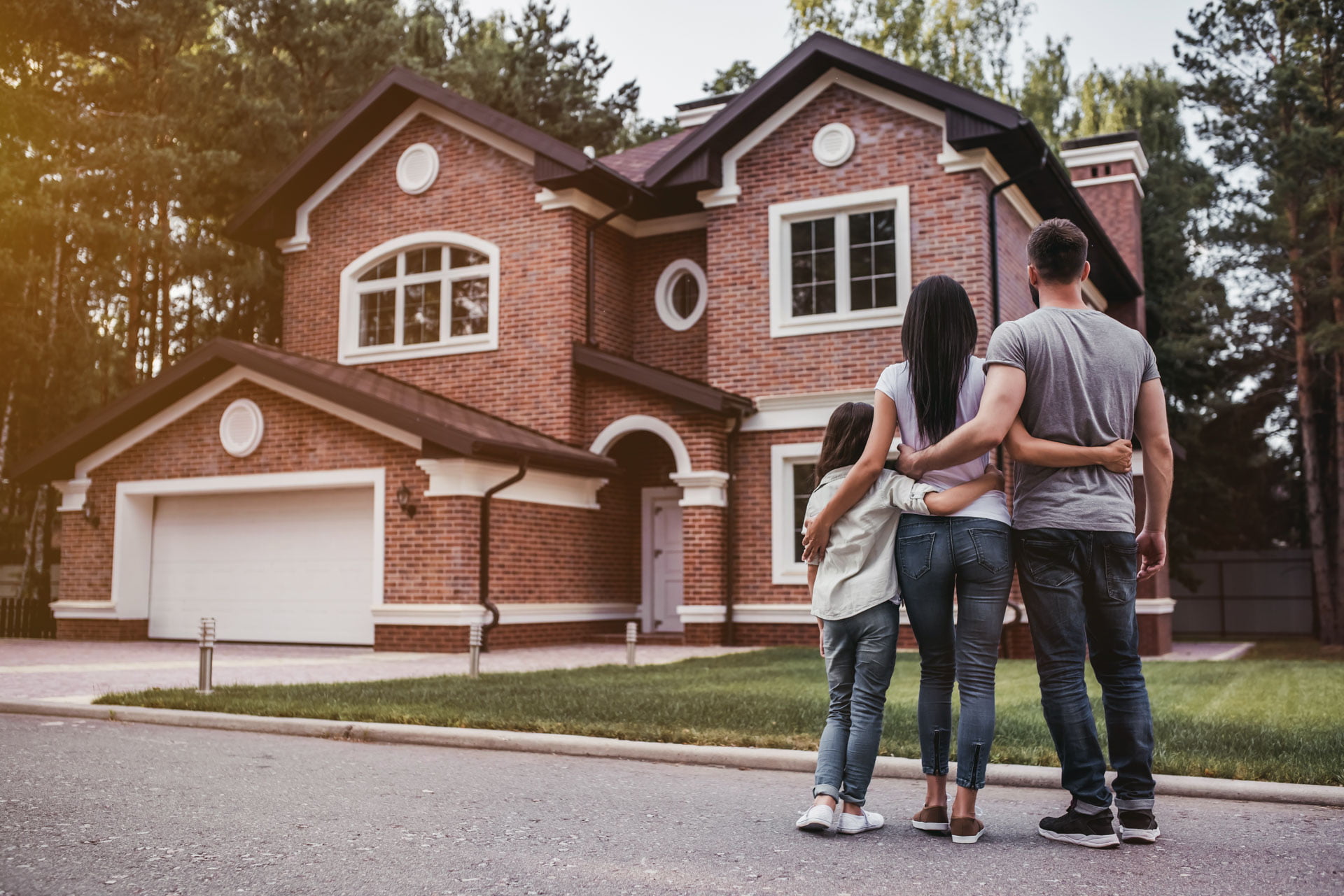 Family Looking At House