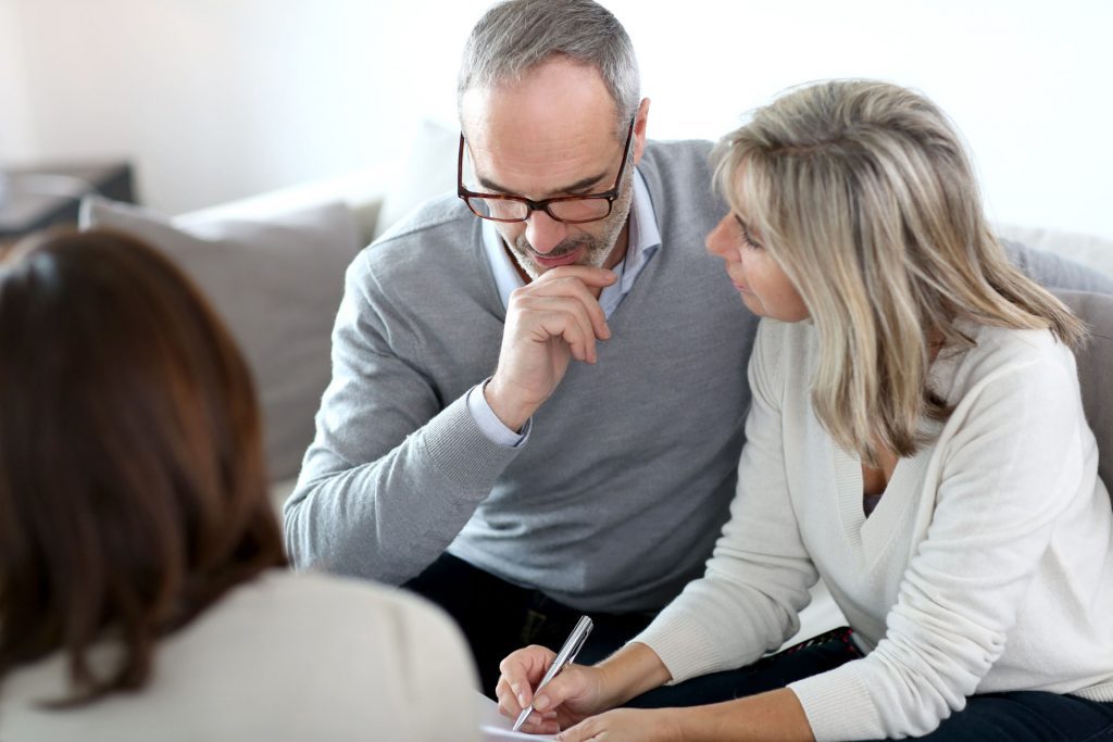 Older Couple Reviewing Home Buying Costs