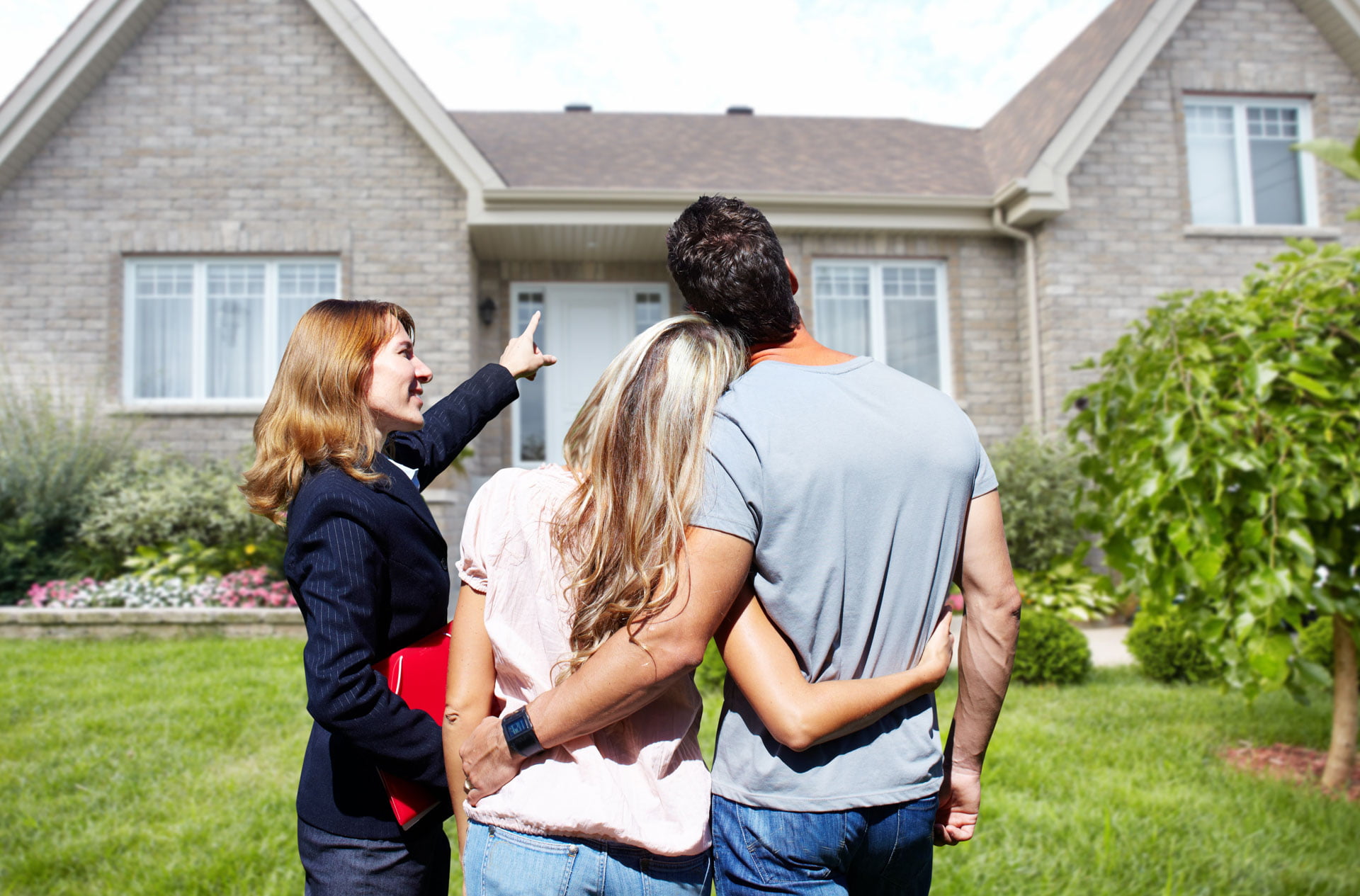 Couple Looking at House Exterior