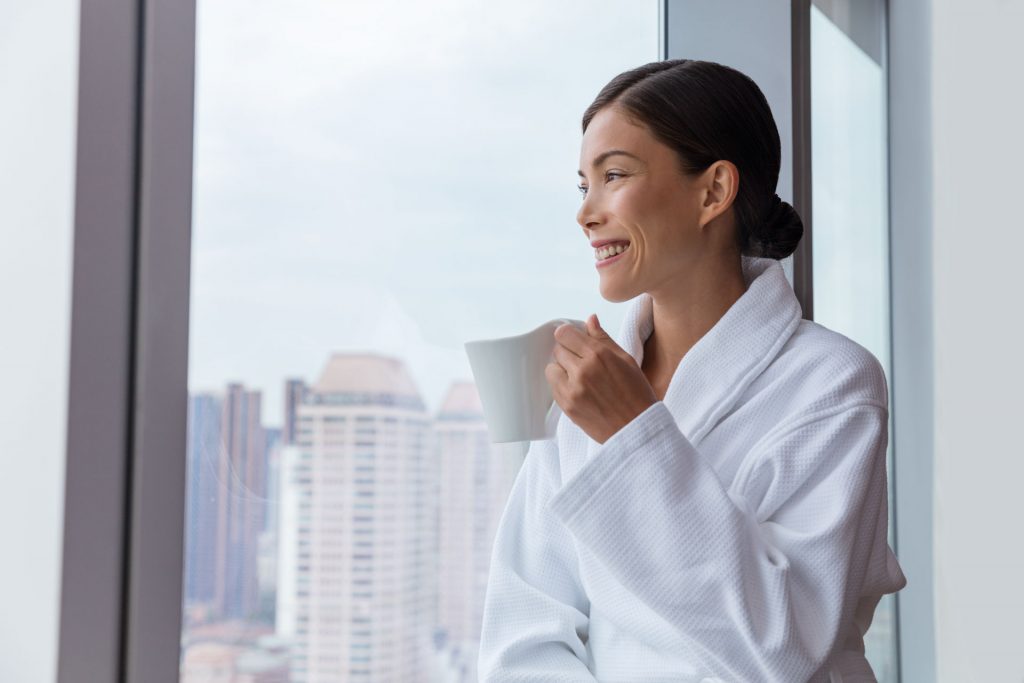 Woman Drinking Coffee Smiling