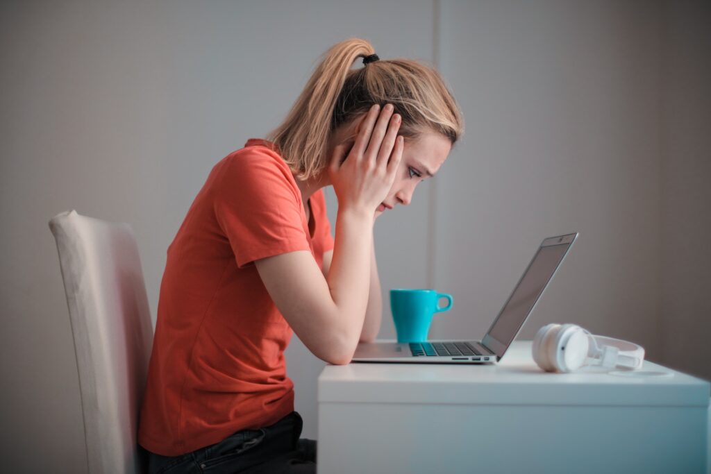 Upset Woman Looking At Taxes