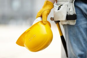 Construction Worker Holding Hardhat